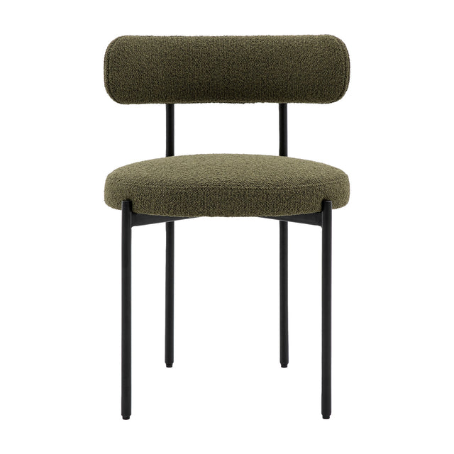 Gallery Direct Avelenne green bouclé dining chair with rounded bolster back, padded seat and slim black iron legs on a white background.