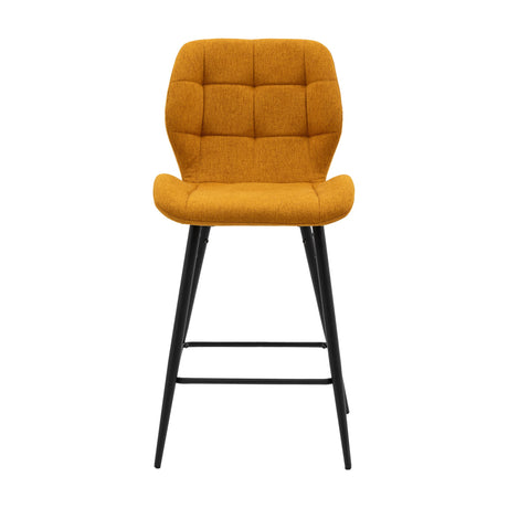 Gallery Direct Manvorne Upholstered Bar Stool in saffron yellow with square-quilted padded back and seat on tapered black metal legs with footrest.