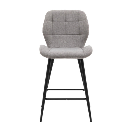 Gallery Direct Manvorne light grey upholstered bar stool with square-quilted padded back and seat on black tapered metal legs with footrest.