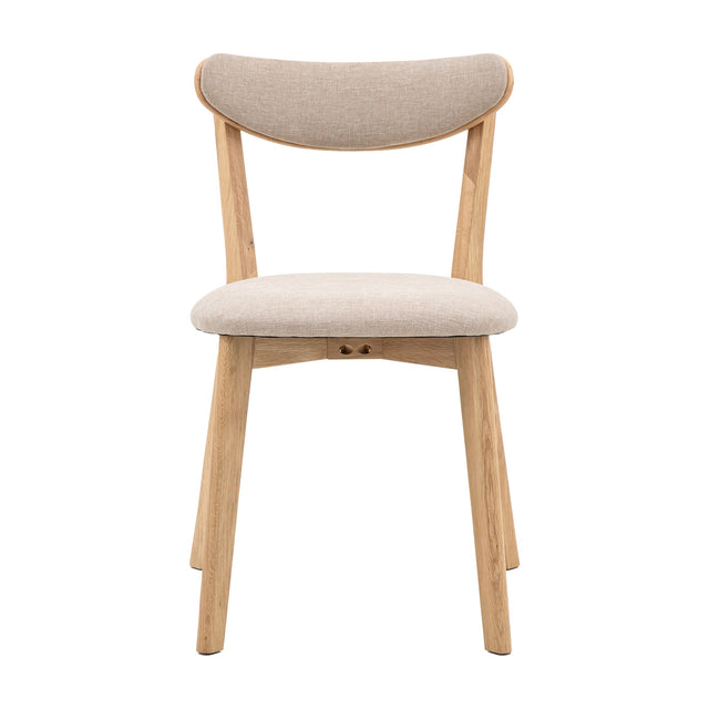 Gallery Direct Hatvenne dining chair with curved neutral fabric back, padded seat and tapered splayed oak legs with stretcher, on a white background.