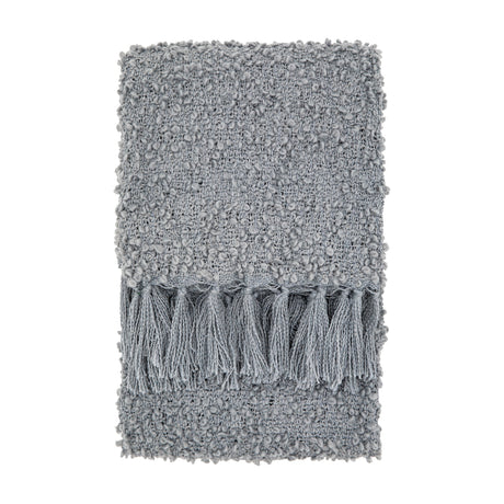 Gallery Direct Bolvane Textured Throw folded to show looped bouclé weave in grey with chunky knotted tassels along the end, on a white background.