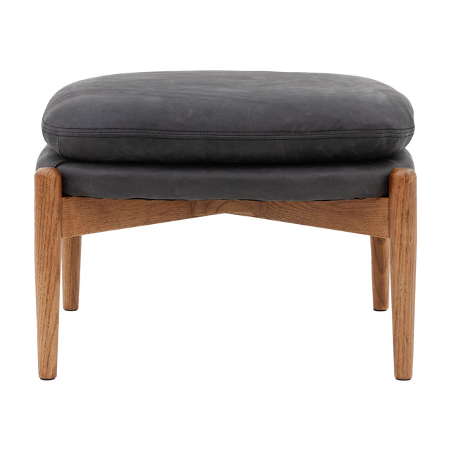 Gallery Direct Datvorne Leather Footstool in Antique Ebony with padded cushion and stitched edge on a solid oak frame with tapered legs.