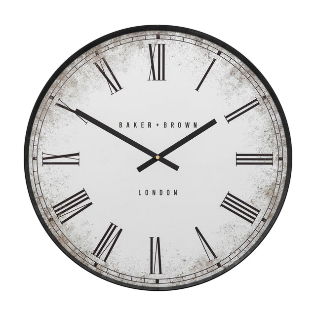 Gallery Direct Chesvane Wall Clock, a large round clock with slim black frame, aged mirror-effect dial, black Roman numerals and BAKER + BROWN LONDON text.
