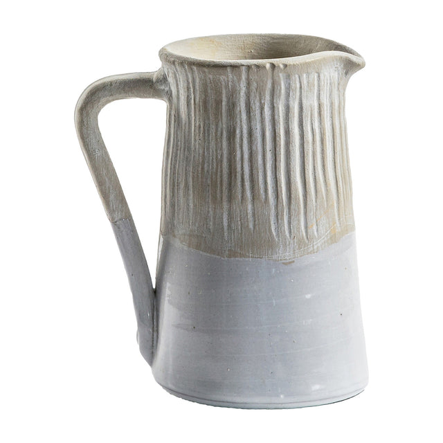 Gallery Direct Morevane Jug in stoneware with ribbed sandy upper half, creamy white lower body, looped handle and pinched pouring spout on a white background.