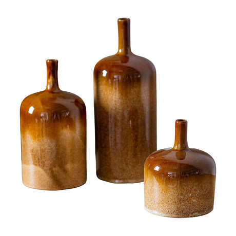 Gallery Direct Vorvane ceramic bottle vases set of 3 in brown reactive glaze, graduated heights with glossy tops and speckled bases on white.