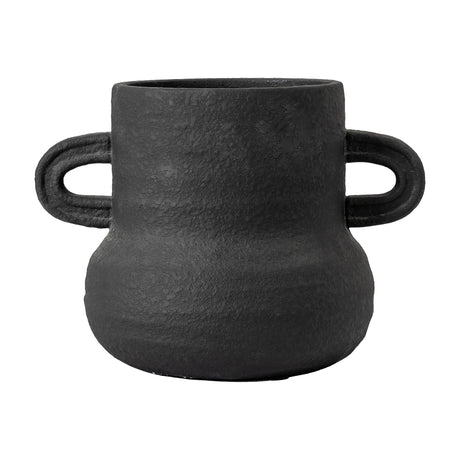 Gallery Direct Gorvane Vase in textured matte black cement, with a rounded base, straight neck and two looped handles, on a plain background.