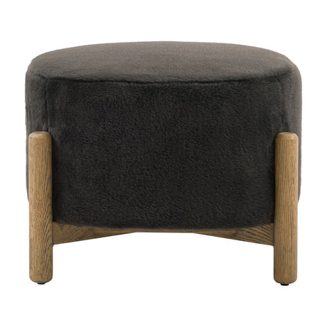 Gallery Direct Tinvane Upholstered Footstool in graphite faux fur with a rounded top and solid oak legs joined by a low cross rail, on a white background.