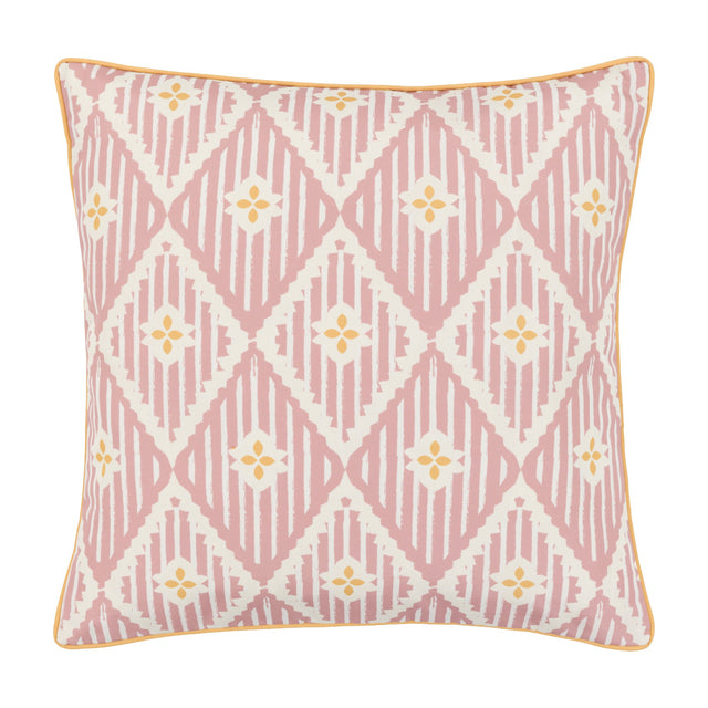 Gallery Direct Oasvane Filled Cushion in pink with a printed diamond lattice, yellow four-petal motifs and contrast piped edge on a white background.