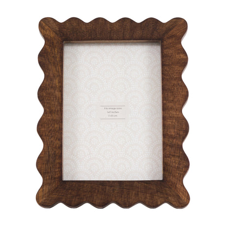Gallery Direct Avlenne wooden 5x7in photo frame with scalloped wavy edge, warm brown grain finish and clear glass front on a plain background.