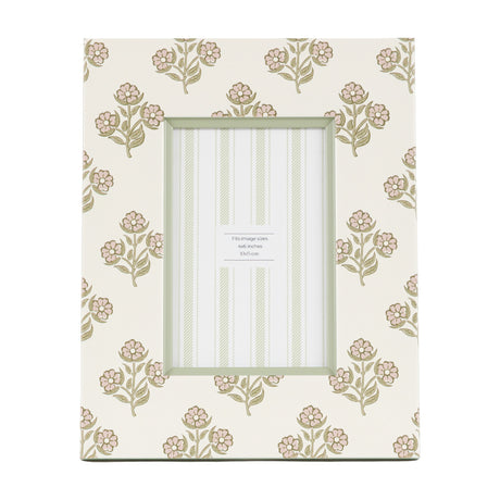 Gallery Direct Rydvane photo frame in cream with dusky pink floral and sage leaf block-print pattern, sage inner border, holding a 6x4in portrait photo.