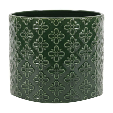 Gallery Direct Selvane Embossed Ceramic Planter in green, a round cylindrical pot with a glossy glazed four-petal floral pattern repeated across the surface.