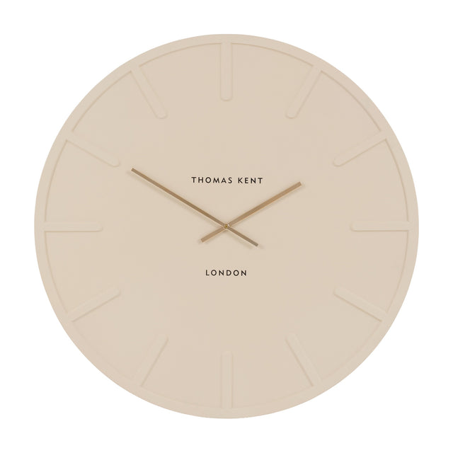 Larvorne Wall Clock by Gallery Direct, a large round cream MDF clock with recessed markers, slim gold-tone hands and Thomas Kent London text.