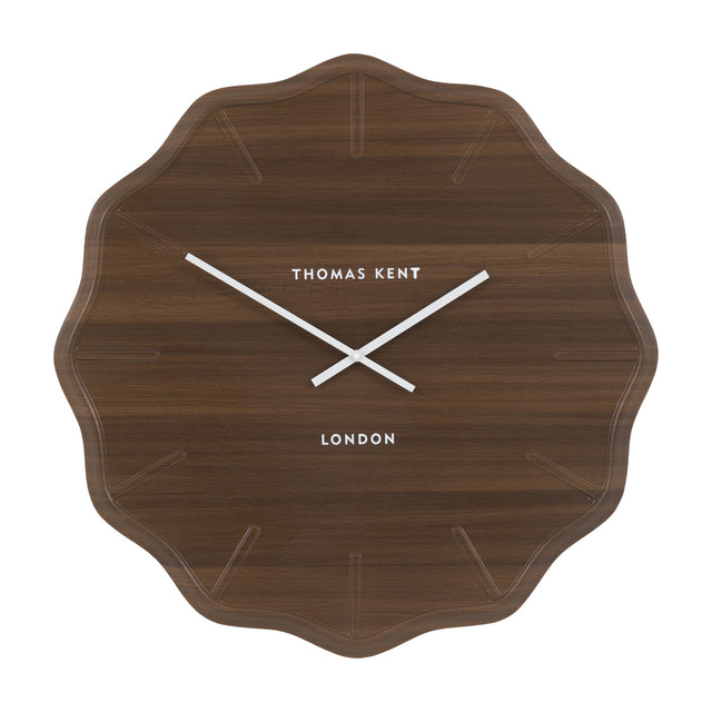 Harvane Wall Clock by Gallery Direct in dark walnut wood-effect finish with scalloped edge, embossed markers, white hands and Thomas Kent London script.