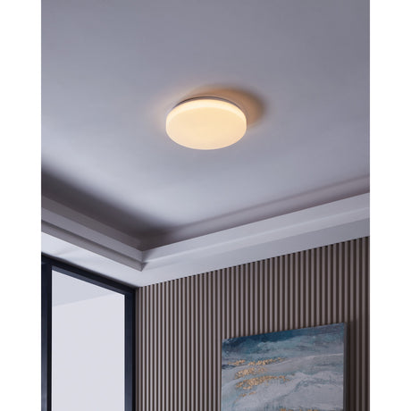 Galmane Smart LED Flush Ceiling Light 38cm in white, round disc design glowing softly on a hallway ceiling with coving and striped wall panelling below.