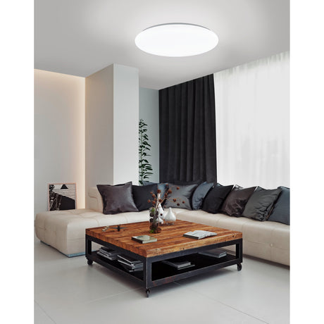 Galmane Smart LED Flush Ceiling Light, round white 53cm fixture with opal diffuser, mounted on a living room ceiling above a sofa and coffee table.