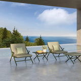 Garda Aluminium Square Outdoor Coffee Table in green with X-shaped legs, shown between two lounge chairs on a poolside terrace overlooking the sea.