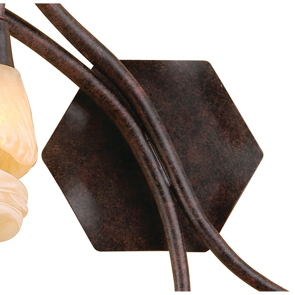 Close-up of the Gaudi Left 2 light wall light showing the square brown oxide metal wall plate with curved arms and amber frosted glass shade.