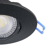 Close-up of a Gedrez round LED downlight in black, showing the plastic body, integrated LED diffuser, and spring clip for ceiling mounting against a white background.