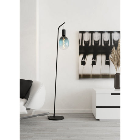 Gilmarne Floor Lamp 170cm in black steel with a curved top arm and hanging holder for a single bare E27 bulb, shown beside a sofa in a living room setting.