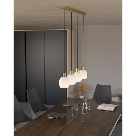 Girbena Glass Linear Pendant Light with four round opal glass shades and brushed brass and gold fittings, hung above a dark wood dining table.