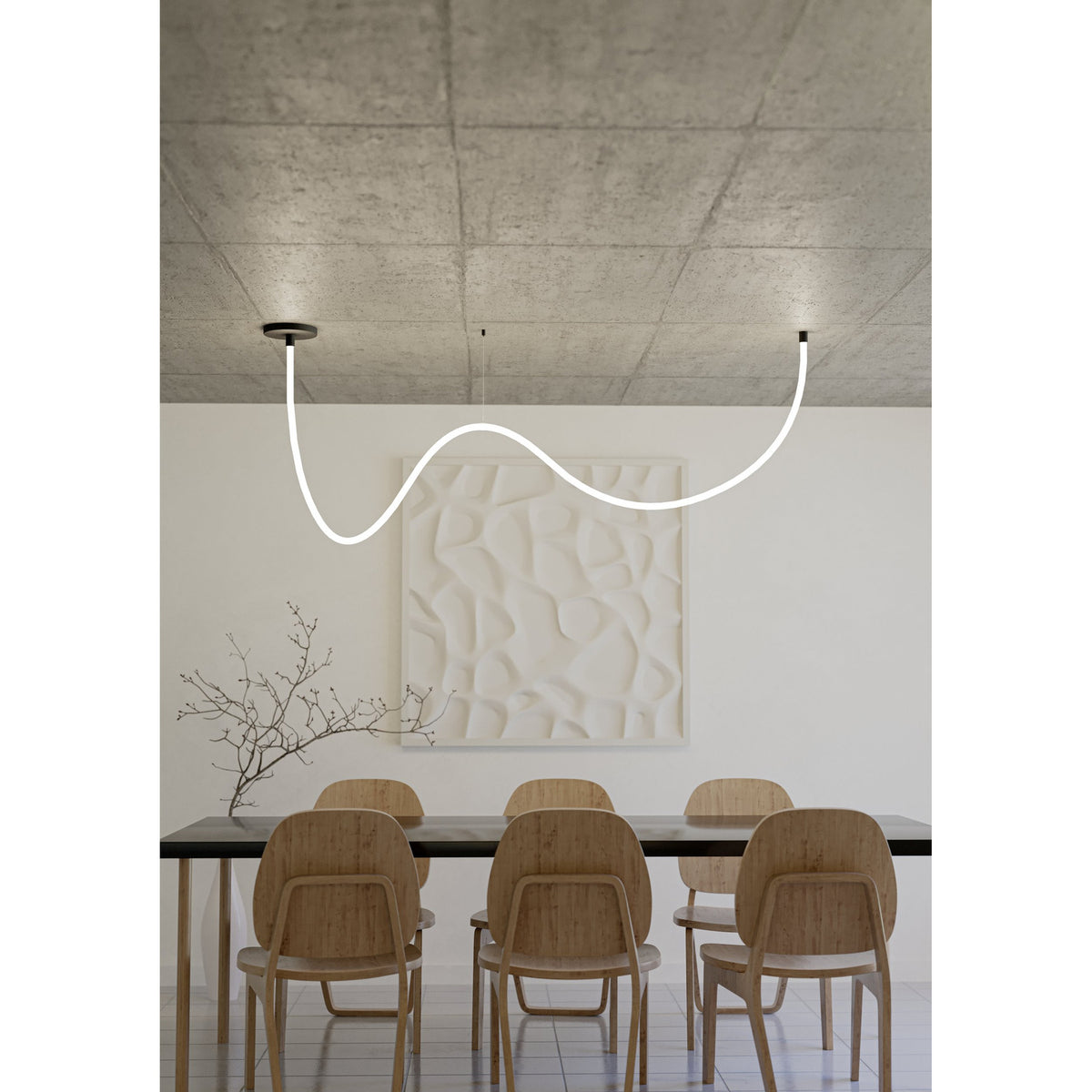 Glow Nw LED Strip Light, 4m flexible linear pendant with white diffuser and textured black ceiling canopies, shown curving above a dining table.