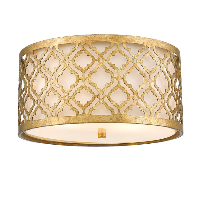 The Arabella 2 Light Flush - Gold With Ivory Shade features a distressed gold metal frame crafted into an elegant drum shape adorned with an intricate lattice pattern. The cylindrical design's geometric cutouts allow for a soft, energy-efficient glow from within, giving the fixture a warm and sophisticated look.