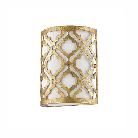 The Arabella 1 Light Wall Light - Gold With Ivory Shade features a decorative gold metal finish, with an intricate lattice pattern on its cylindrical frame. Its contemporary elegance is enhanced by a cream linen fabric shade, providing a soft and sophisticated touch against a white background.