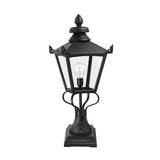 The Grampian 1 Light Pedestal Lantern in black is a vintage-style outdoor fixture crafted from cast aluminium with a clear glass design. This Victorian lantern style radiates classic charm, featuring one light bulb inside and an elegantly square base, ideal for enhancing your outdoor lighting ambiance.