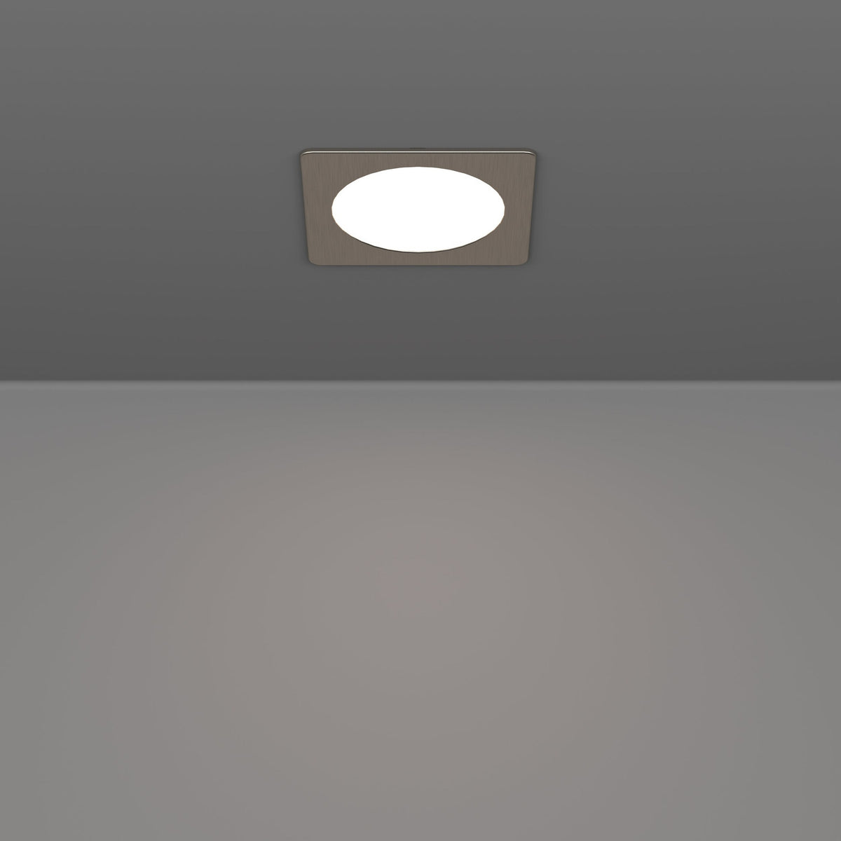 Gosmelle LED Downlight, 11.7 x 11.7cm, recessed into a grey ceiling, square satin nickel bezel framing a round white diffuser, illuminated and shown above a plain grey interior.