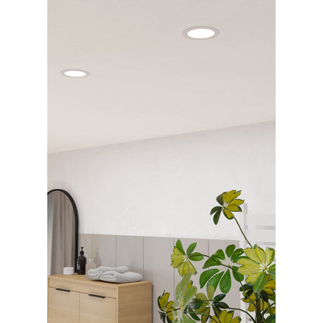 Gosmelle LED downlights, 11.9cm round white recessed fixtures with opal diffusers, installed in a bathroom ceiling above a wood vanity and plant.