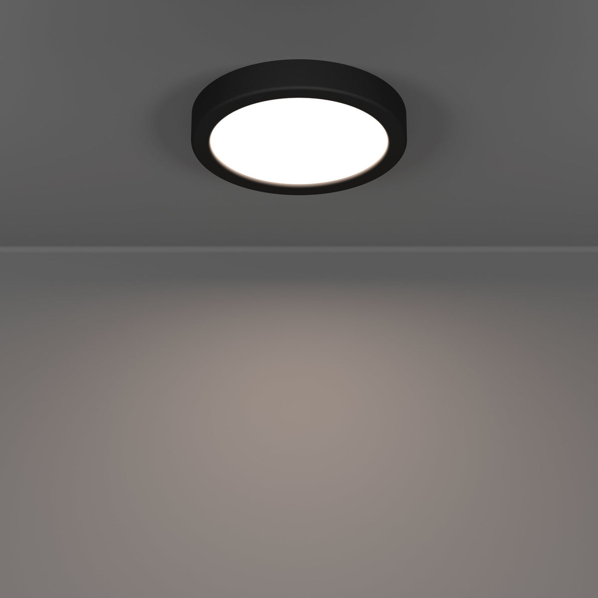 Gosmelle LED downlight in black plastic with round white diffuser, mounted on a grey ceiling and casting warm light downward, IP44 rated, 16.6 x 2.5cm.