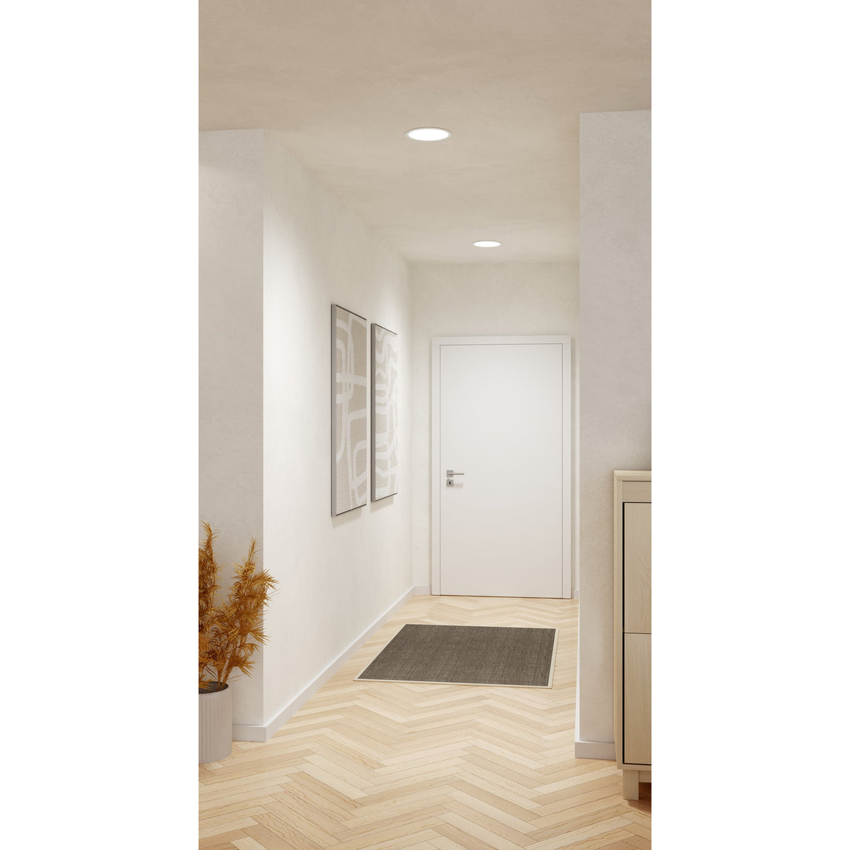 Gosmelle round LED downlights, white finish, recessed into a hallway ceiling providing warm white light above a white door and framed artwork.
