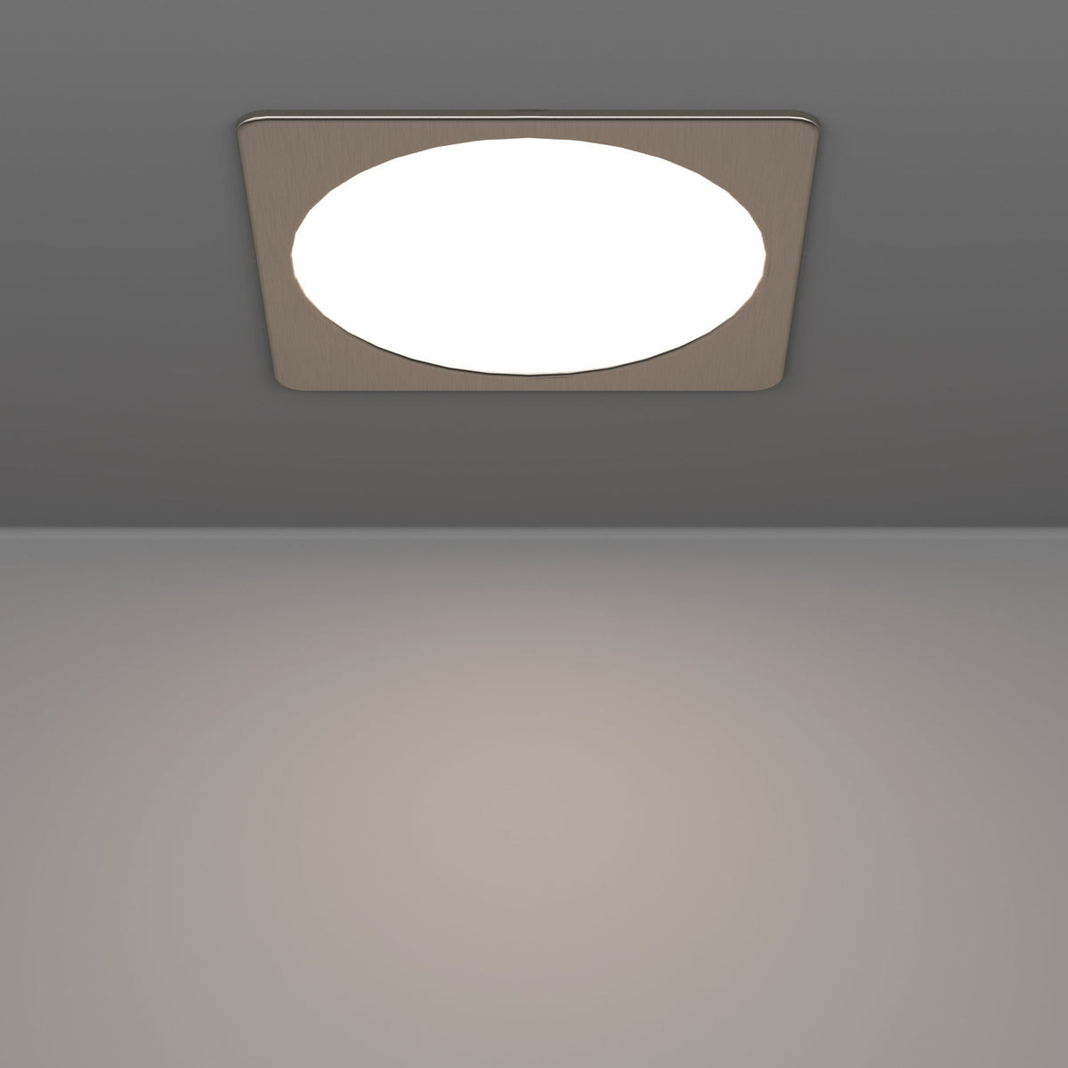 Gosmelle LED Downlight 21.6cm in satin nickel, square plastic trim with round white diffuser, mounted on a grey ceiling above a plain room.