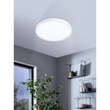 Gosmelle round LED downlight in white, 28.5cm, surface-mounted on a ceiling in a grey hallway with warm white glow, IP44 rated.