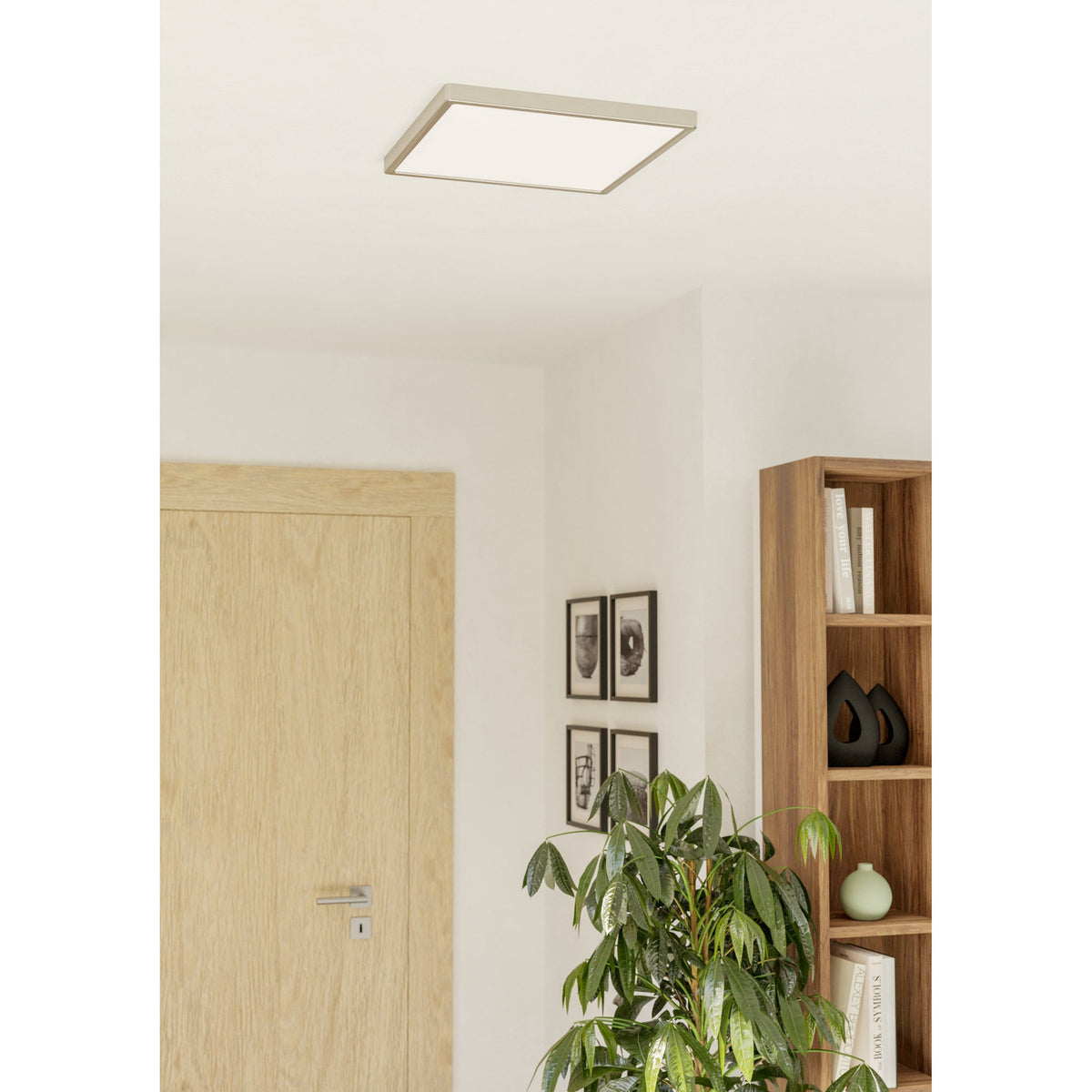 Gosmelle square LED downlight, 39 x 39cm, satin nickel frame with white diffuser, mounted flush on a hallway ceiling near a wooden door and bookshelf.