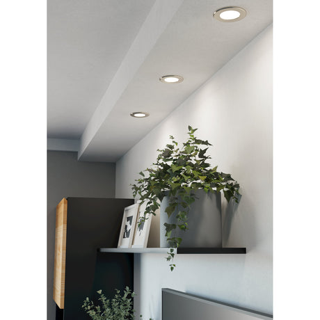 Gosmelle LED downlights, 8.8cm round recessed fixtures with satin nickel bezels and white diffusers, installed along a hallway ceiling above a shelf with plants and framed photos.