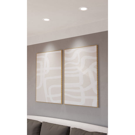 Two round white recessed LED downlights, Gosmelle 12cm smart ceiling fixtures with flat diffusers, shown installed in a grey-walled room above framed abstract artwork.