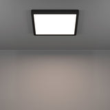 Gosmelle square LED downlight with black plastic frame and white diffuser panel, mounted flush on a grey ceiling, illuminated in a plain room setting.