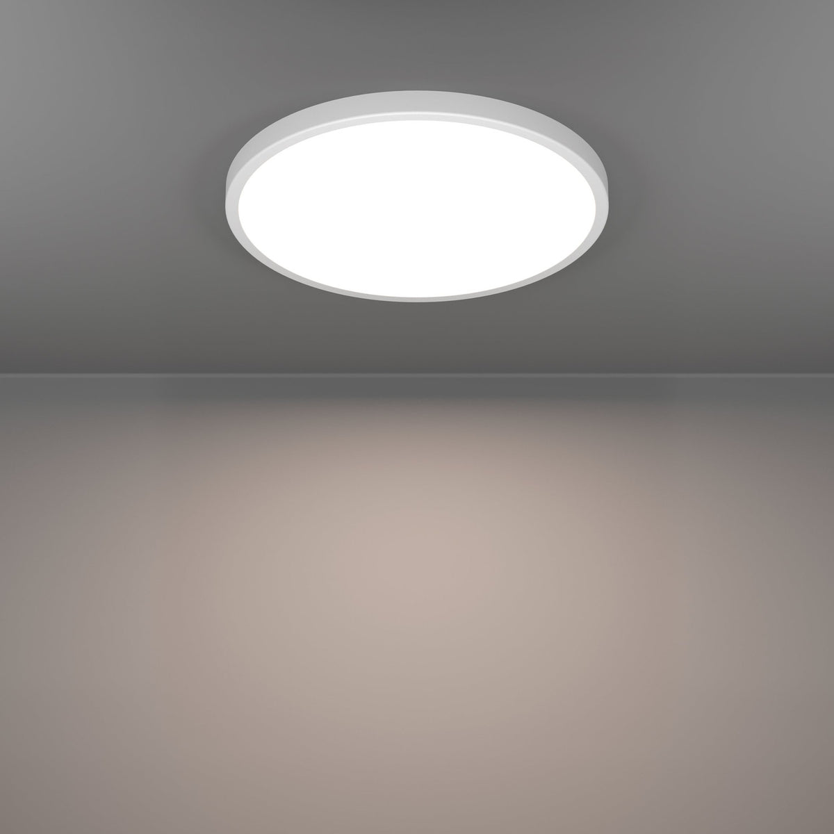 Gosmelle round LED downlight, 38.9cm white plastic fitting flush-mounted on a grey ceiling, illuminated with warm white light across the room below.