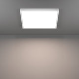 Gosmelle square LED downlight, 39 x 39cm, white plastic frame and diffuser, flush ceiling mount, shown lit with warm white glow against a grey wall.