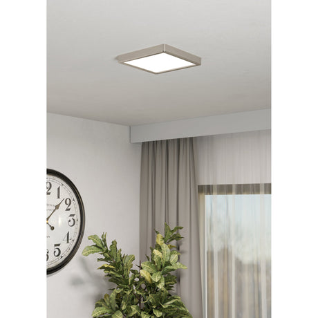 Gosmelle Smart LED Downlight, a square 22 x 22cm ceiling fixture with satin nickel frame and white diffuser, shown fitted flush on a light room ceiling.
