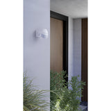 Granvena PIR Sensor 180° in white plastic, wall-mounted beside a front door with a domed hood and round motion detector lens.