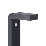 Close-up of the Grelbine black solar outdoor floor lamp, showing the slim square post with rounded corner into a flat head with solar panel and integrated motion sensor, on a white background.