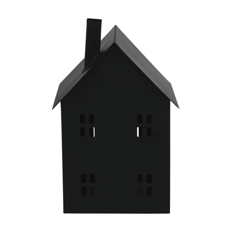 Gutapol black metal candle lantern shaped like a house, with pitched roof, square chimney and four-pane window cut-outs, shown on a plain white background.