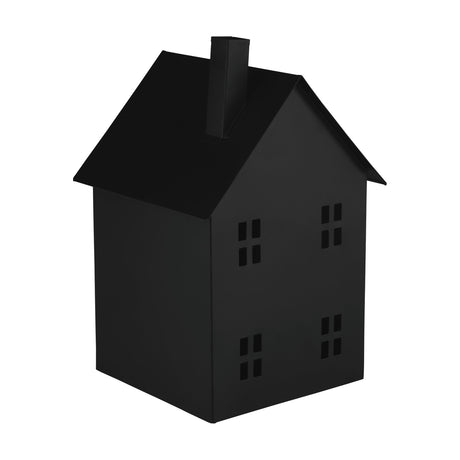 Gutapol metal candle lantern in black, shaped like a house with a pitched roof, square chimney and four-pane window cut-outs, shown on a plain white background.