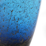 Close-up of the Brown Flecked Tall Glass Vase 41cm in blue, showing bronze speckled texture and glossy glass surface against a white background.