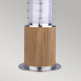 The Poole 1 Light Mini Bollard - Light Brown showcases a sleek cylindrical wooden base, enhanced by a metal grill crafted from Marine Grade 316 Stainless Steel, encasing a frosted glass light fixture. Perfect for garden or pathway lighting, this mini bollard design introduces a contemporary touch.