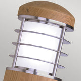 The Poole 1 Light Outdoor Wall Light in light brown offers a modern design with its wooden cap and base. It features marine grade stainless steel rings that encircle a frosted glass center, providing a contemporary aesthetic against a neutral backdrop. Additionally, its IP44 rating ensures durability in any weather conditions.