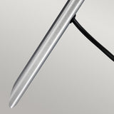 A close-up of the Spennymoor 1 x 12V Spotlight and Pole, featuring a sleek, metallic design reminiscent of a pen with its smooth cylindrical form and an attached thin black wire, set against a plain background.