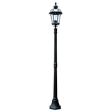 The Ledbury 1 Light Lamp Post - Black, featuring a tall vintage-style design with a heritage lantern-shaped light housing and decorative finials on top, is meticulously crafted from cast aluminium and stands against a plain white background.